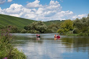 People enjoy canoe excursion on Mainschleife of Main river